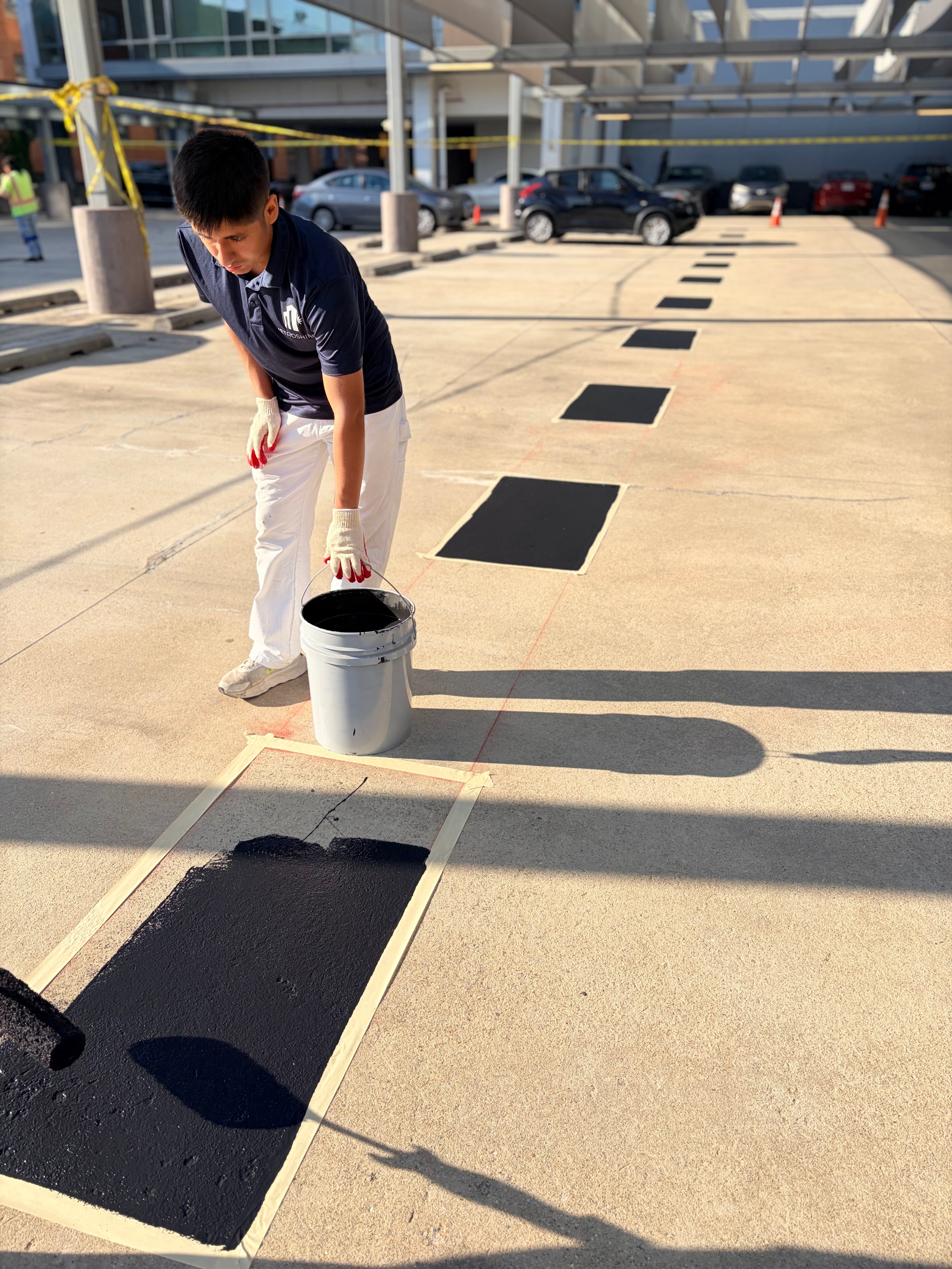MetroShine crew painting parking lot spaces